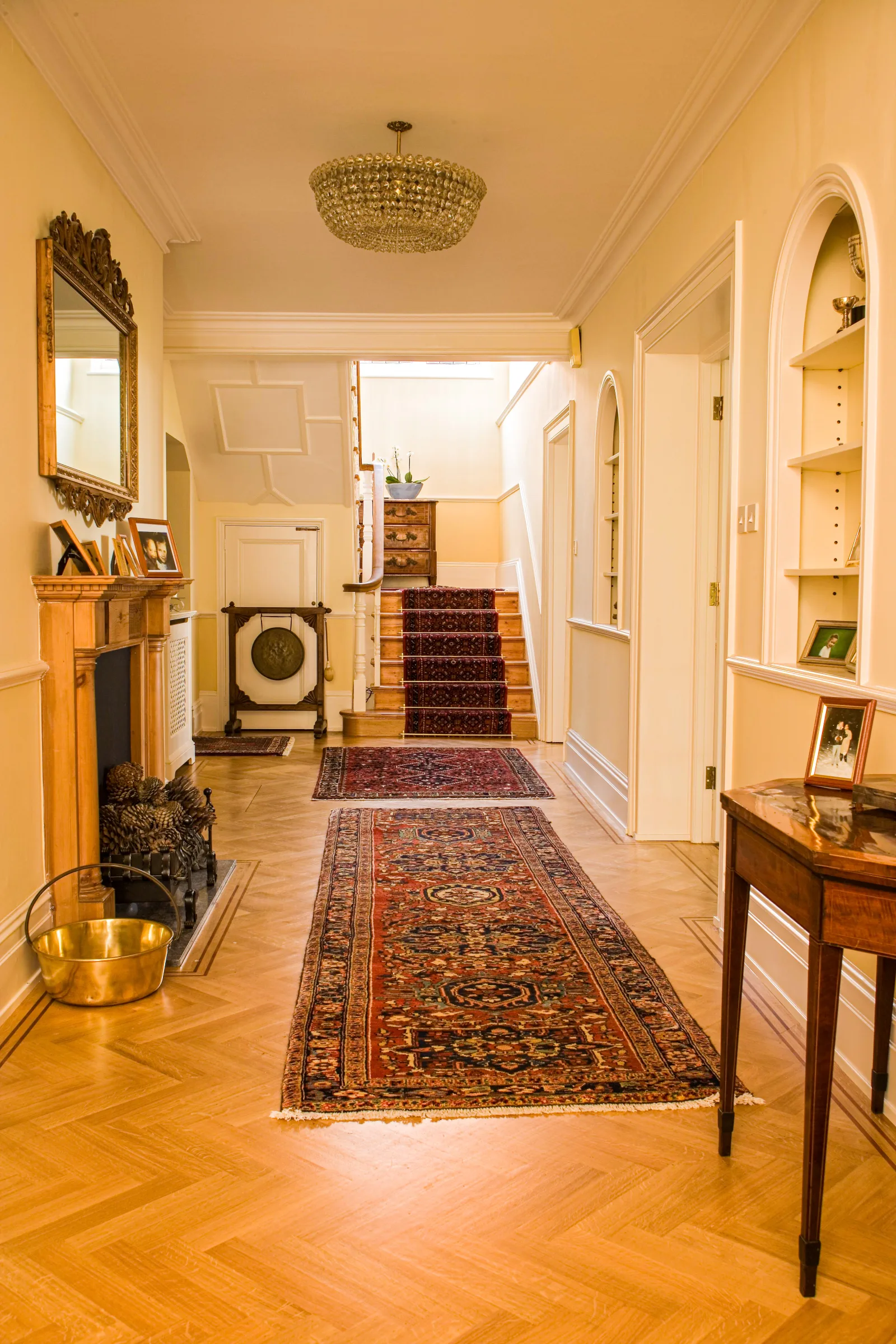 Sanded herringbone hallway with an inlay border